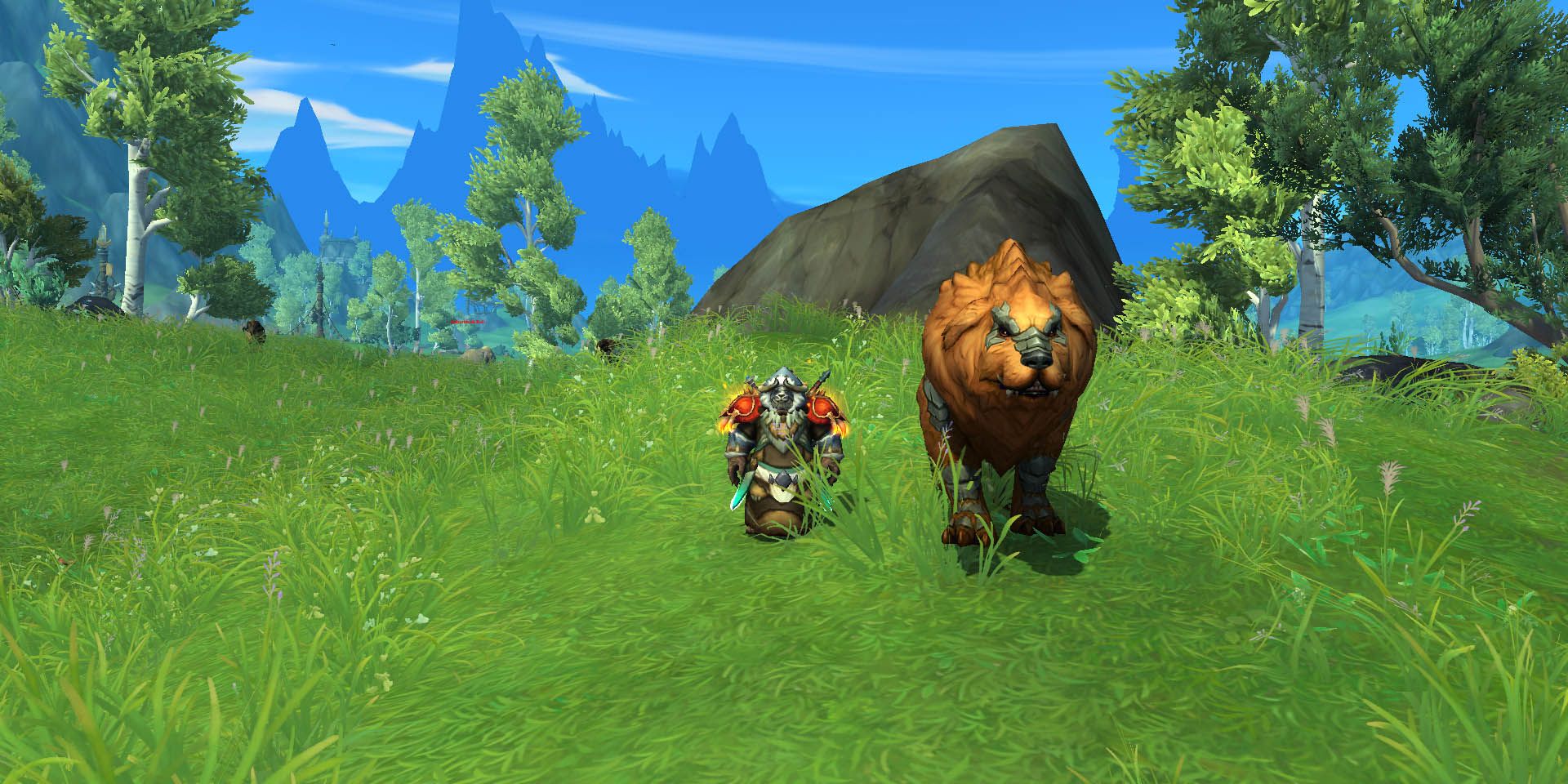 Wow: Ein Pandaren-Mönch, der mit einem großen Tier auf einem Feld steht