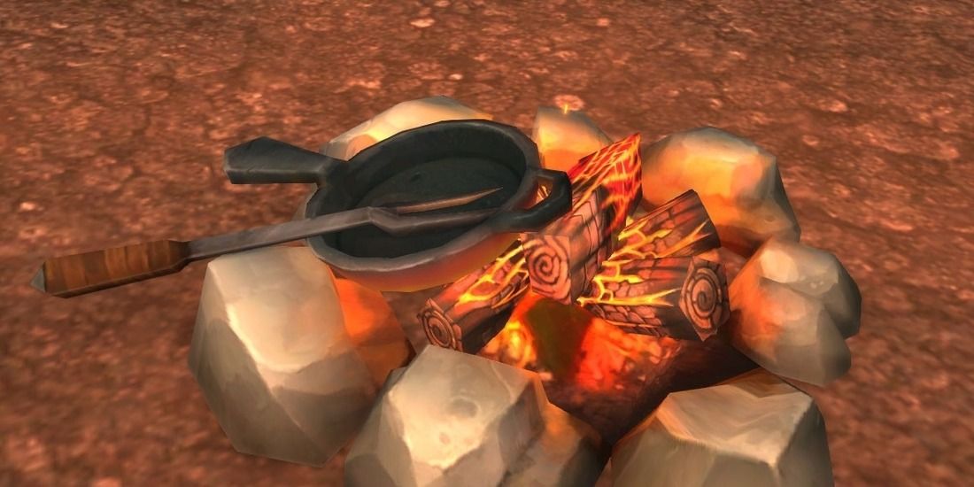 Eine Bratpfanne und eine Gabel, die in World of Warcraft auf einem Lagerfeuer platziert werden