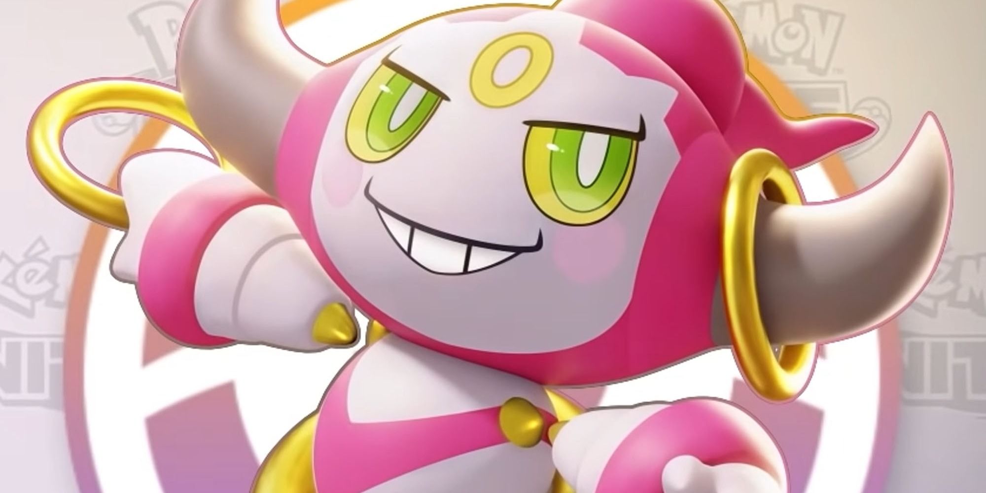 Hoopa lächelt verschmitzt, während er seine Reifen festhält.