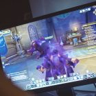 Woman playing World of Warcraft: Battle of Azeroth game